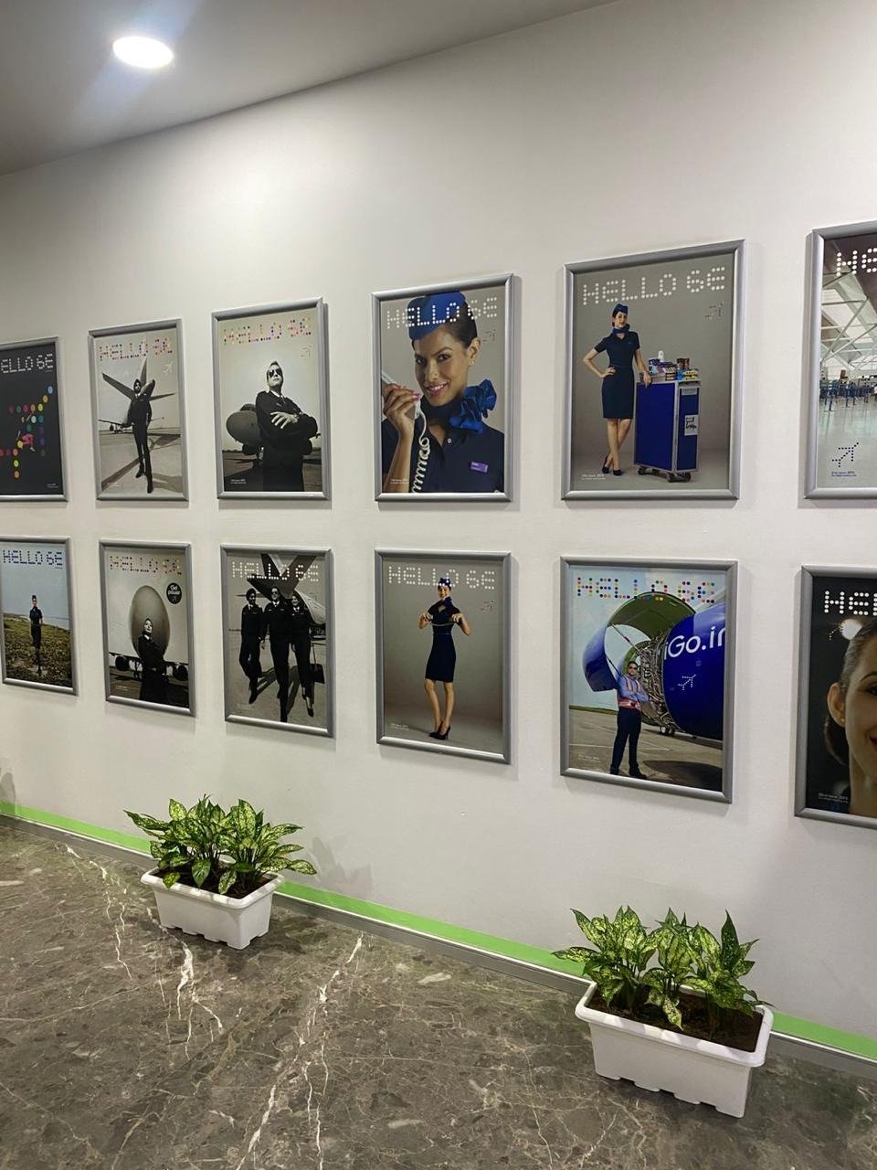 Corridor of an IndiGo airline training centre lined with cabin crew posters